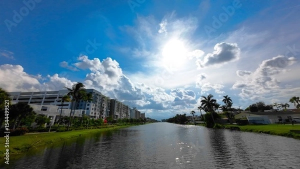 Fototapeta Bright sunlight under water with building on background