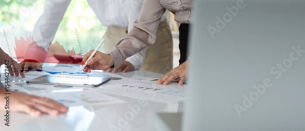 Fototapeta Business people evaluate project efficiency and financial return on investment with business team working for marketing research and business strategy plan.