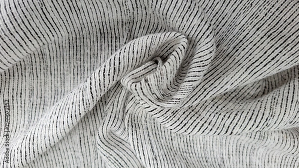 Fototapeta Textile's Textured Embrace: Close-up capture of textile fabric with unique texture showcasing the intricate details of the material. Revealing a captivating blend of textures and patterns.