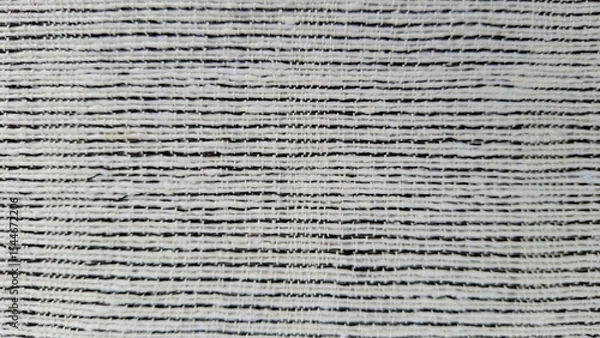 Fototapeta Textured Monochrome Pattern: A close-up shot showcases a striking monochrome pattern, defined by layered horizontal lines, creating a dynamic texture.