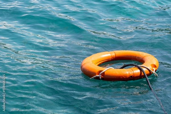 Obraz Lifebuoy floats on the ocean. Security concept.