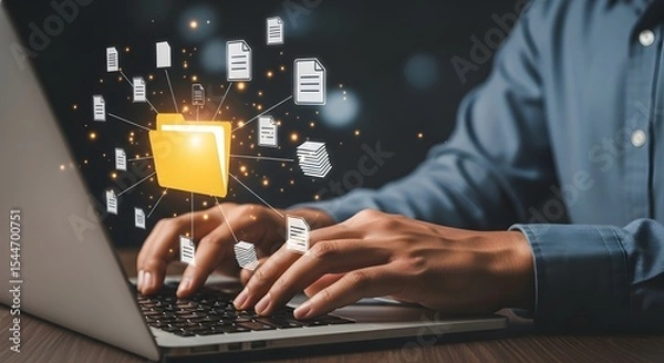 Fototapeta Person using laptop for online data management accessing files and folders via cloud computing technology