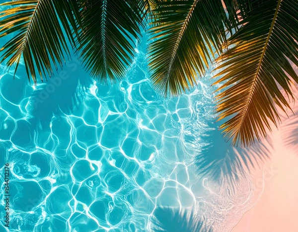 Fototapeta Palm tree leaves casting shadow over crystal clear swimming pool water