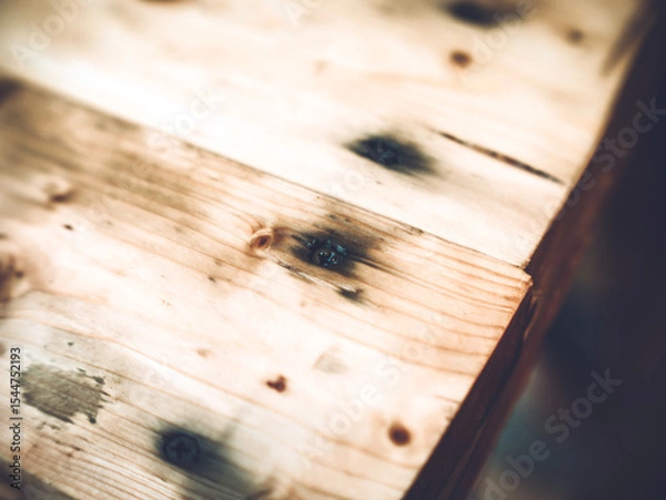 Obraz the black self-tapping screw is screwed into the wood