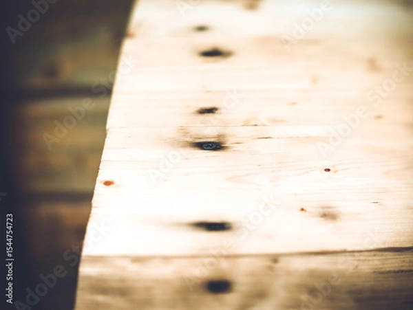 Obraz the black self-tapping screw is screwed into the wood