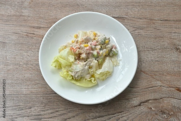 Obraz mashed tuna with corn and garden pea couple cabbage vegetable salad dressing cream sauce on plate