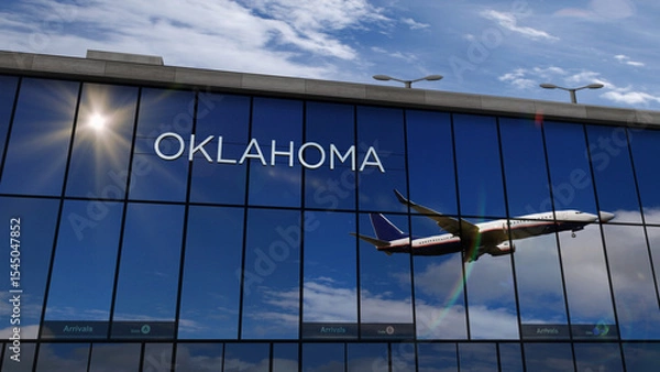 Fototapeta Airplane landing at Oklahoma USA,  airport mirrored in terminal