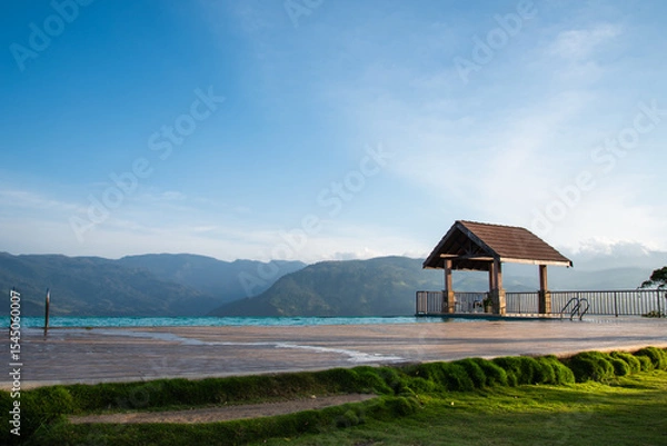 Fototapeta Infinity pool facing mountain view