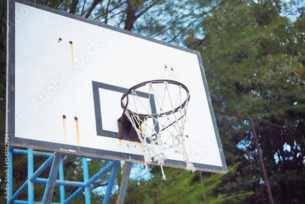 Obraz A basketball hoop hanging on a backboard