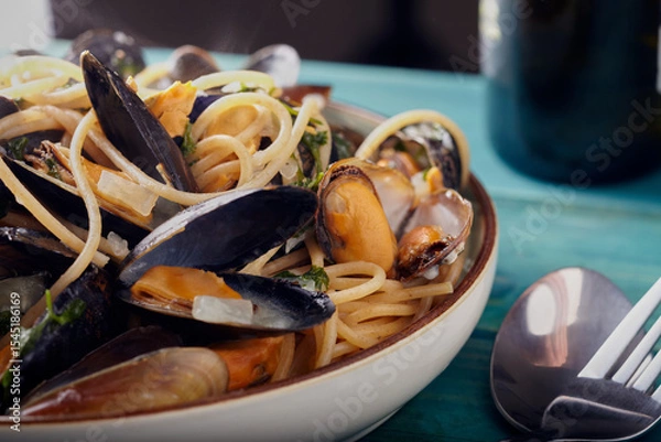 Obraz Scottish mussels with pasta in a garlic butter and white wine sauce.