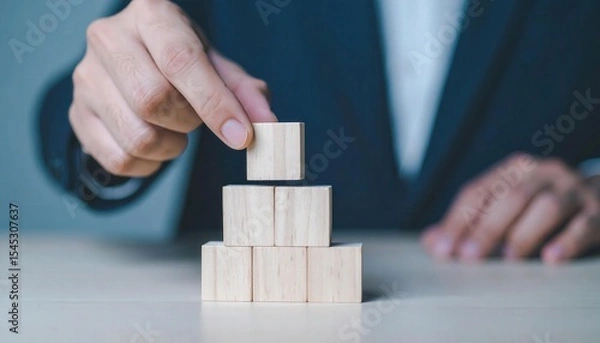 Obraz Building a Financial Foundation with Wooden Blocks in Business Environment
