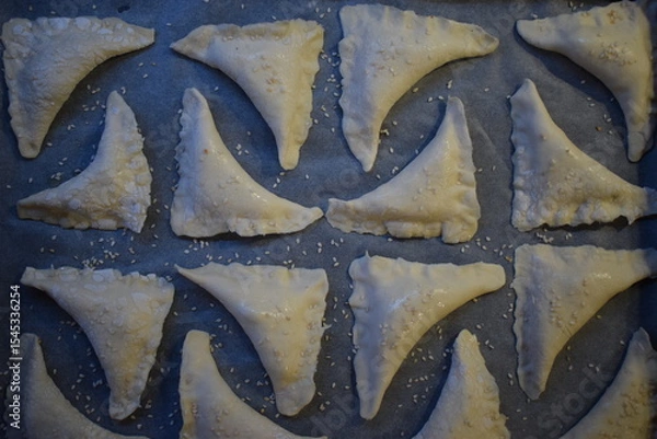 Fototapeta Simple Pleasures: A Tray of Uncooked Pastries, Ready for Baking