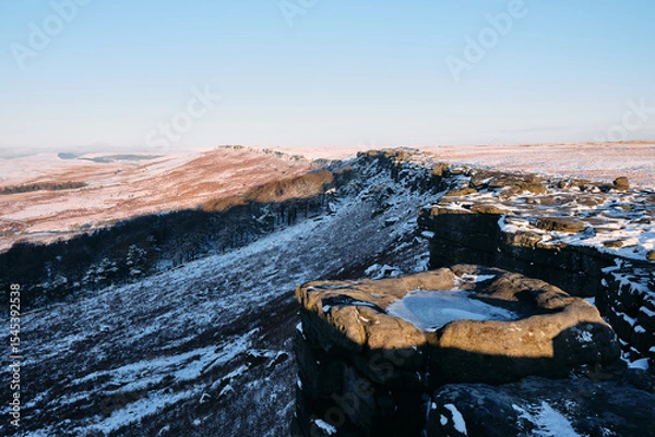 Obraz Morning light on Stanage Edge with snow, Peak District, UK