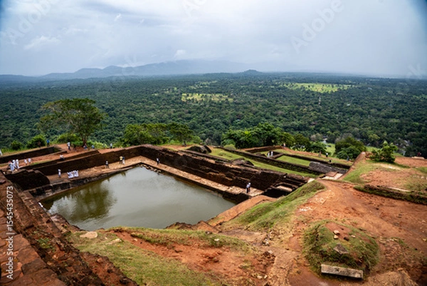 Fototapeta Stone ruins of the ancient fortress atop Sigiriya Rock, Sri Lanka—historic site with sweeping views and history
