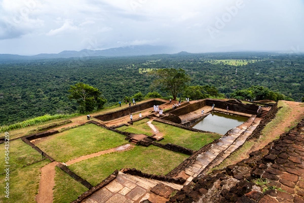 Fototapeta Stone ruins of the ancient fortress atop Sigiriya Rock, Sri Lanka—historic site with sweeping views and history