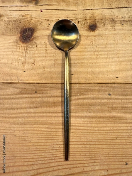 Obraz Golden spoon on a rustic wooden table
