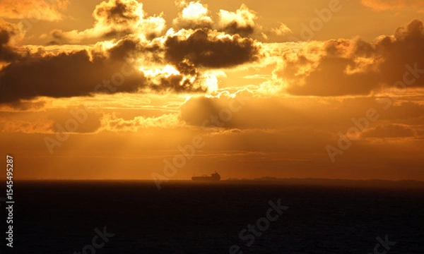 Obraz Sailing into hazy orange sunrise