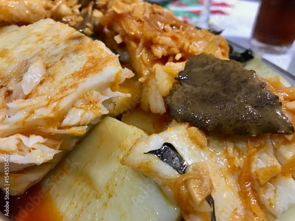 Obraz Codfish with Garlic, Paprika, and Fresh Herbs