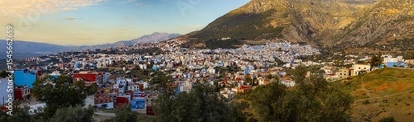 Fototapeta Hillside town with colorful buildings.