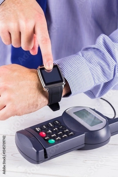 Obraz Man using smart watch to express pay