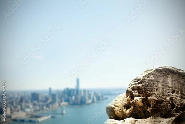 Obraz Large rock overlooking coastline city
