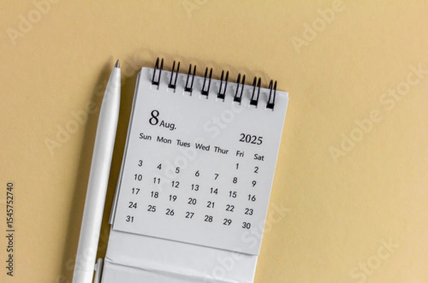 Fototapeta Hello, August 2025. Desktop calendar for planning on a beige background with a copy of space.