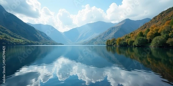Fototapeta Coniston Water's serene surface reflects majestic fells , hills, clouds, spring