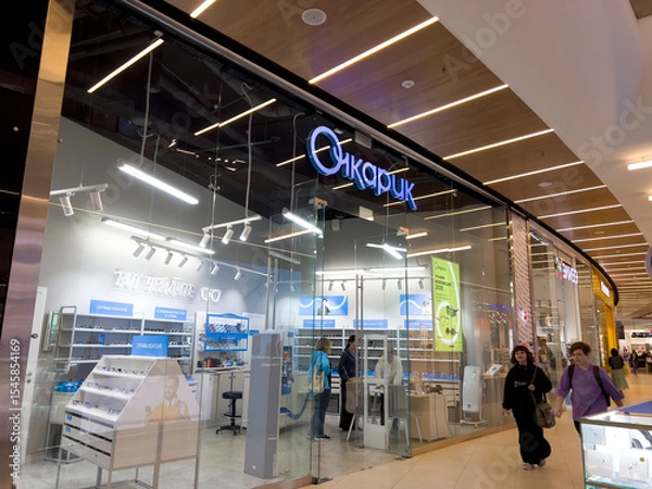 Obraz A store with a blue sign that says "The bespectacled man". Russia. Moscow. 21.06.25.