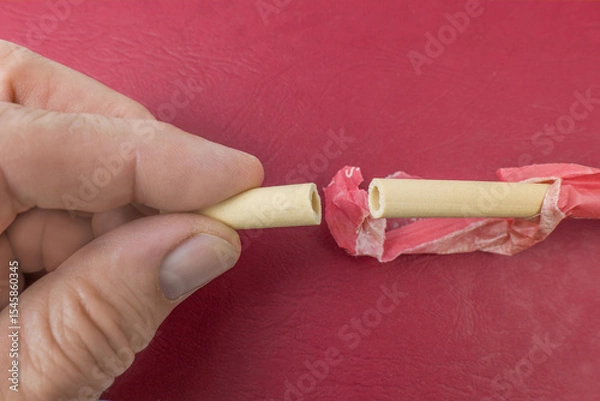 Fototapeta Edible straw on a red background