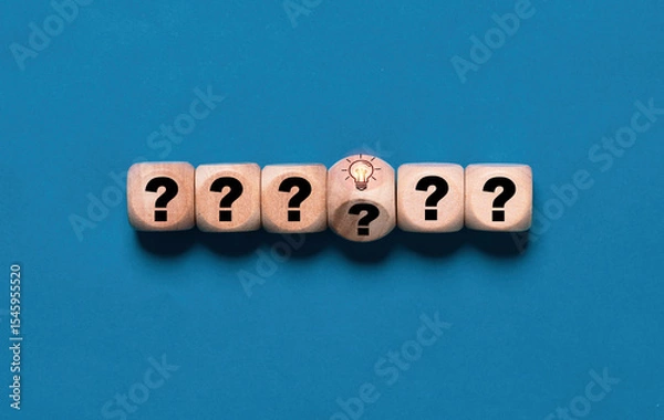 Fototapeta Flipping wooden block cube change from question to glowing lightbulb for smart thinking and solution problem. It is creative thinking idea and innovation concept.