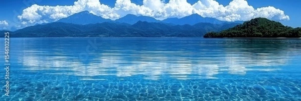 Obraz Tranquil turquoise waters with distant mountains and cloudy sky.