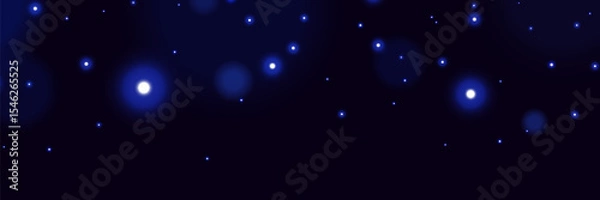 Obraz Blue glowing particles on dark background with soft bokeh light effect and dreamy cosmic atmosphere