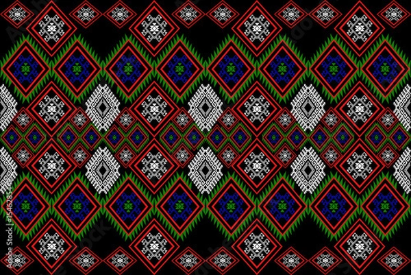 Fototapeta An intricate pixel art textile pattern featuring layered diamond motifs in vivid red, green, blue, and white on a black background. Inspired by traditional Southeast Asian tribal art and adapted for m