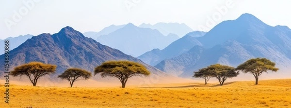 Obraz Expansive Desert Landscape with Silhouetted Trees and Majestic Mountain Range