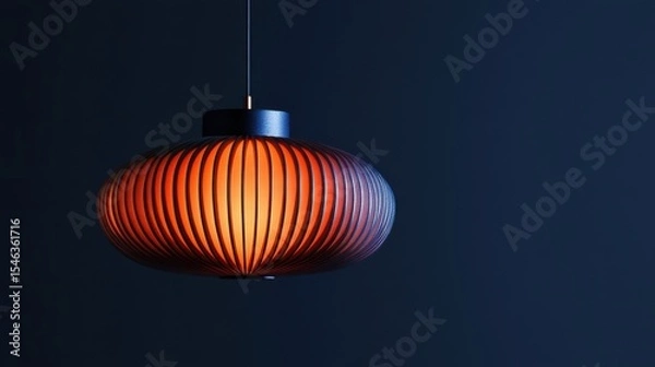 Obraz Modern Hanging Pendant Lamp with Striped Shade and Warm Glow in Dark Setting