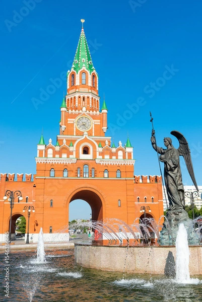 Obraz Monument-fountain Archangel Gabriel against the background of the Annunciation Tower in Yoshkar-Ola. Russia