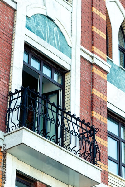Obraz Balcony with black cast iron railing on old European style house