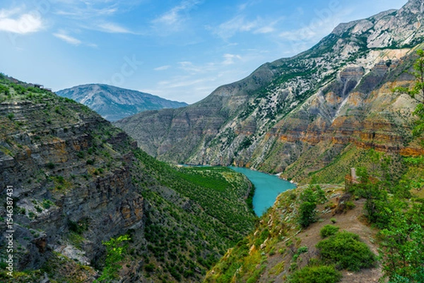 Obraz Panoramic landscape of a deep picturesque canyon of the Caucasian mountains of Dagestan and the azure mountain river Sulak. Russia