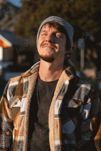 Fototapeta Happy Man in Plaid warml Shirt and Beanie in Suburban Setting