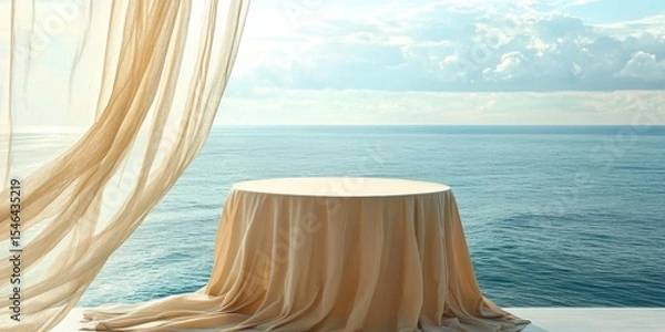 Fototapeta Serene ocean view with a beautifully draped table, perfect for events, weddings, or culinary presentations in a coastal setting.