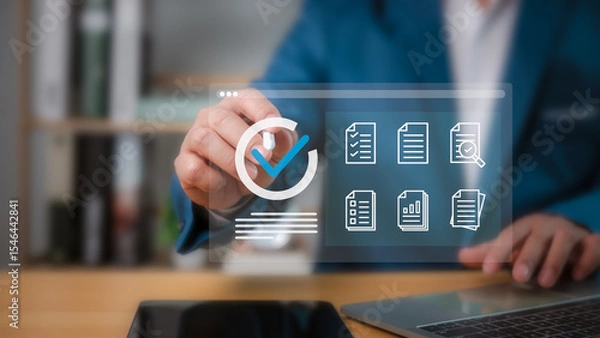 Obraz Businessman checklist and filling survey form online,  Audit business concept, Compliance with internal organization financial services regulation, Examination for business and financial management.