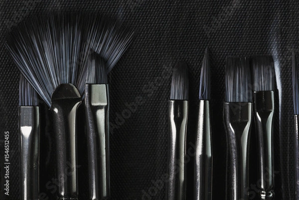 Fototapeta A set of art brushes for drawing on a black background