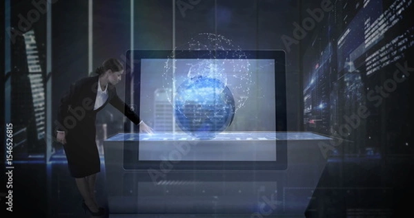 Fototapeta Interacting executive in suit operating touchscreen table at high-tech office, 3D globe, copy space