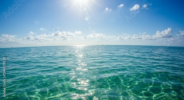 Fototapeta Sunlight shimmering on the ocean surface creating a peaceful water scene