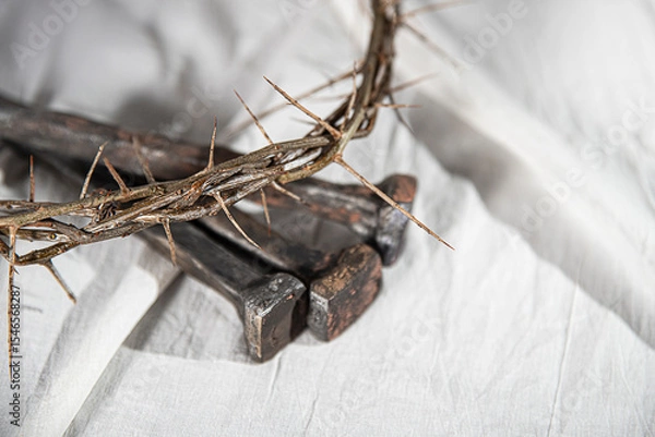 Fototapeta Crown of Thorns and Holy Nails associated with the Passion of Jesus Christ. Symbol of the Crucifixion at Calvary and Good Friday in Christianity according to the New Testament