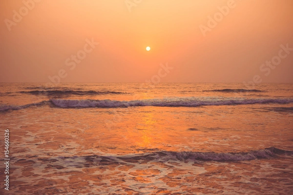 Obraz Colorful sunset over the ocean Vagator Beach, south Goa, India.