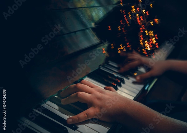 Fototapeta The piano player hands, playing music abstract photography with notes shaped bokeh. Dark music style background