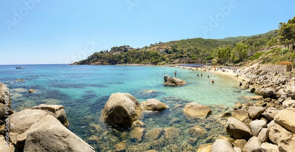 Obraz View to Cannelle beach, Spiaggia delle Cannelle, near Giglio Porto with view to mediterranean sea and beautiful blue bay at Isola del Giglio, island of the tuscan archipelago, Grosseto Tuscany Italy