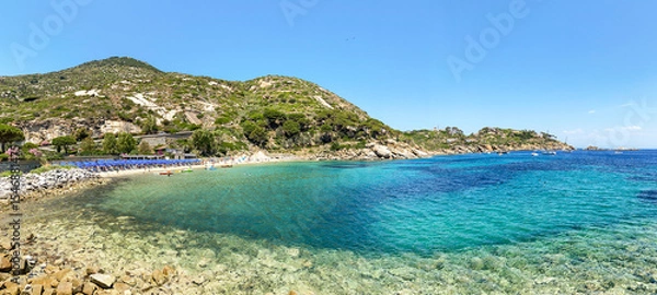 Obraz View to Cannelle beach, Spiaggia delle Cannelle, near Giglio Porto with view to mediterranean sea and beautiful blue bay at Isola del Giglio, island of the tuscan archipelago, Grosseto Tuscany Italy