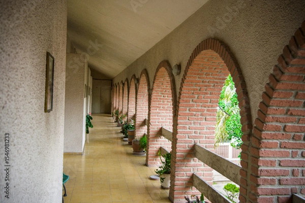 Fototapeta A view of a passage in an old-style architectural house.